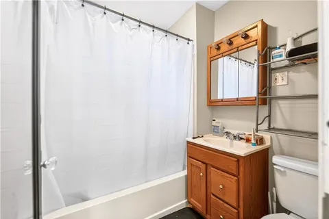 a bedroom with furniture and white walls