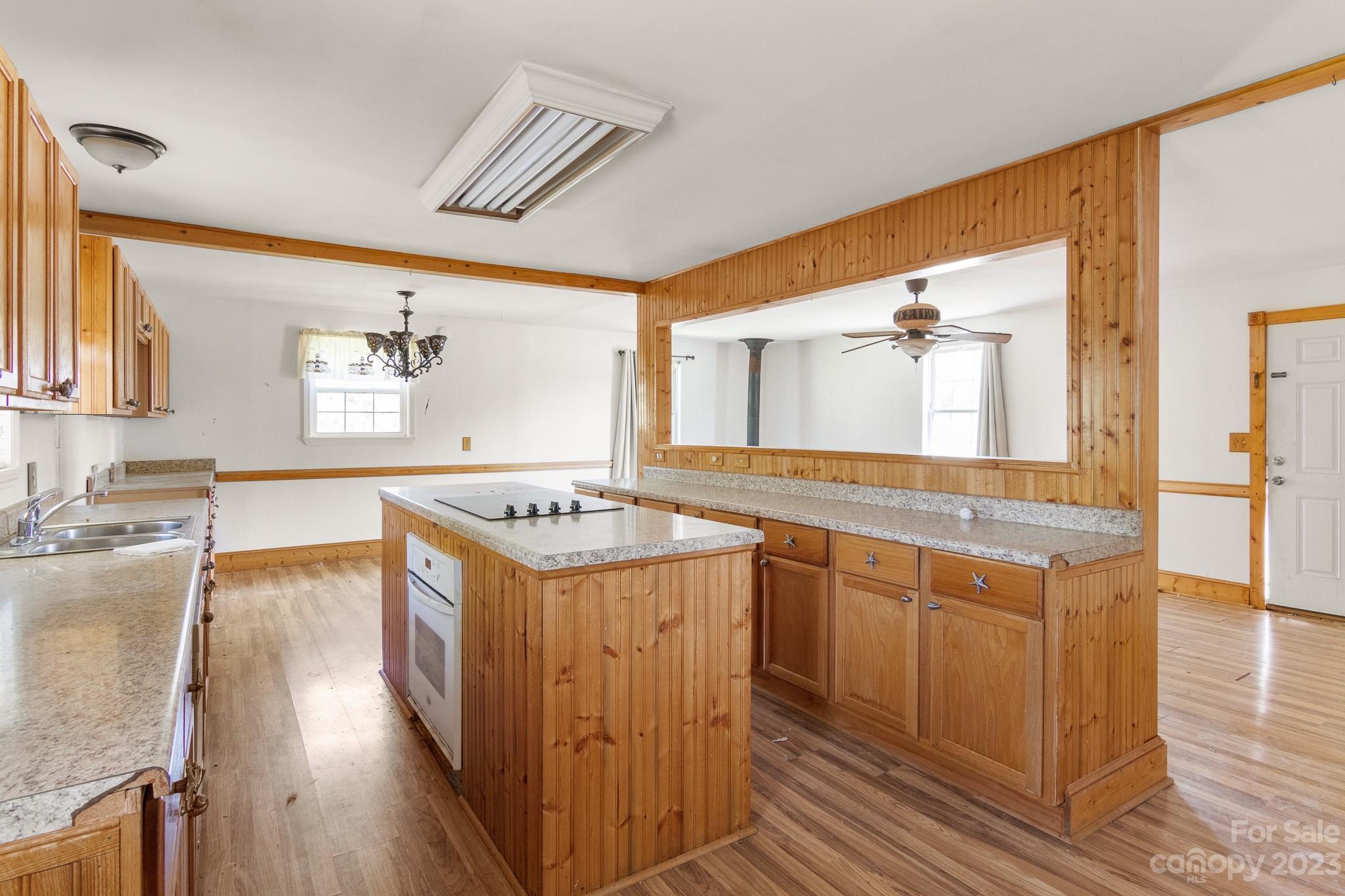 716 Robin Avenue Kannapolis, NC 28081 - Photo 15 of 25 a kitchen with a stove and wooden cabinets