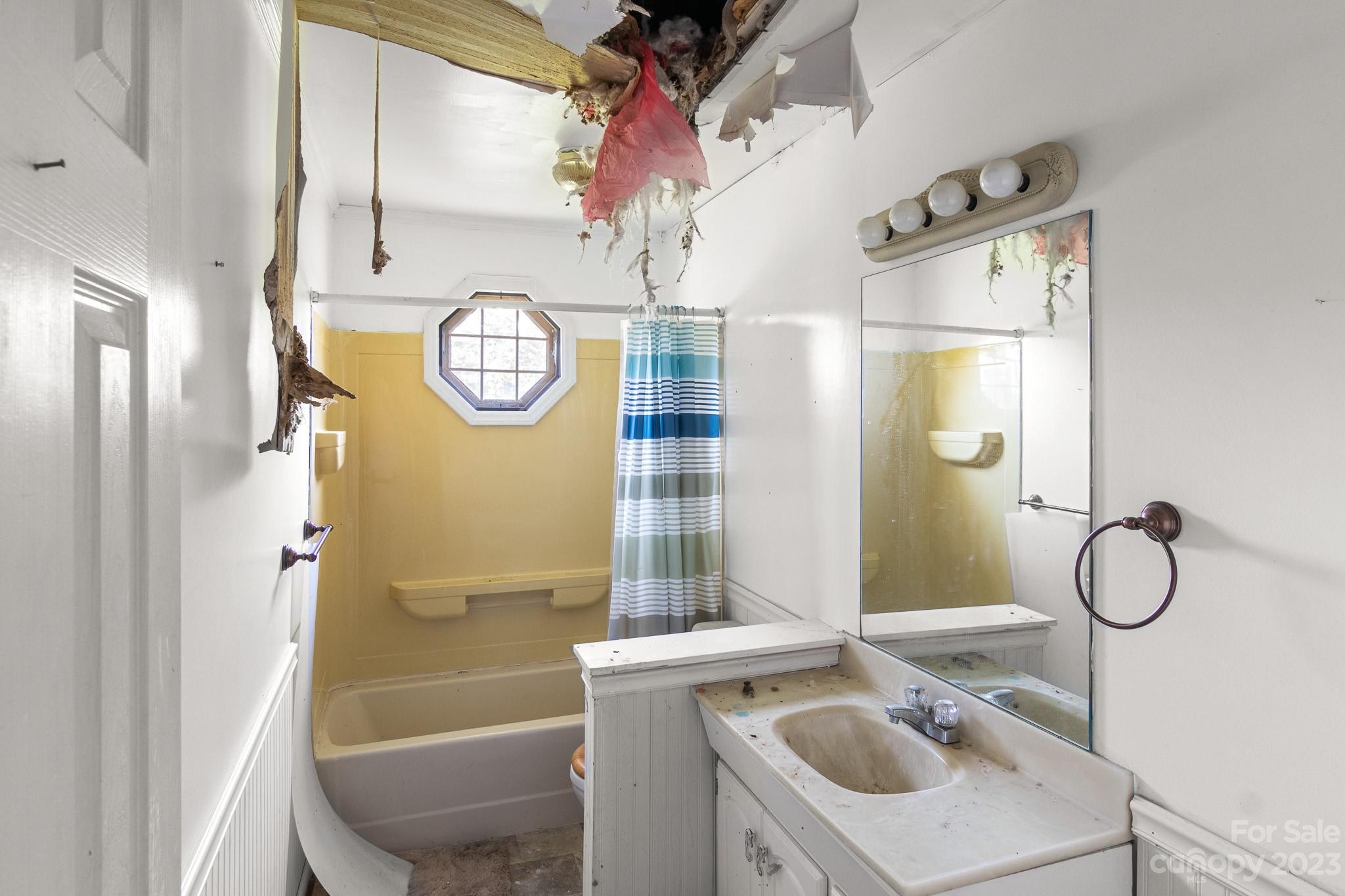 716 Robin Avenue Kannapolis, NC 28081 - Photo 19 of 25 a bathroom with a sink a toilet and shower
