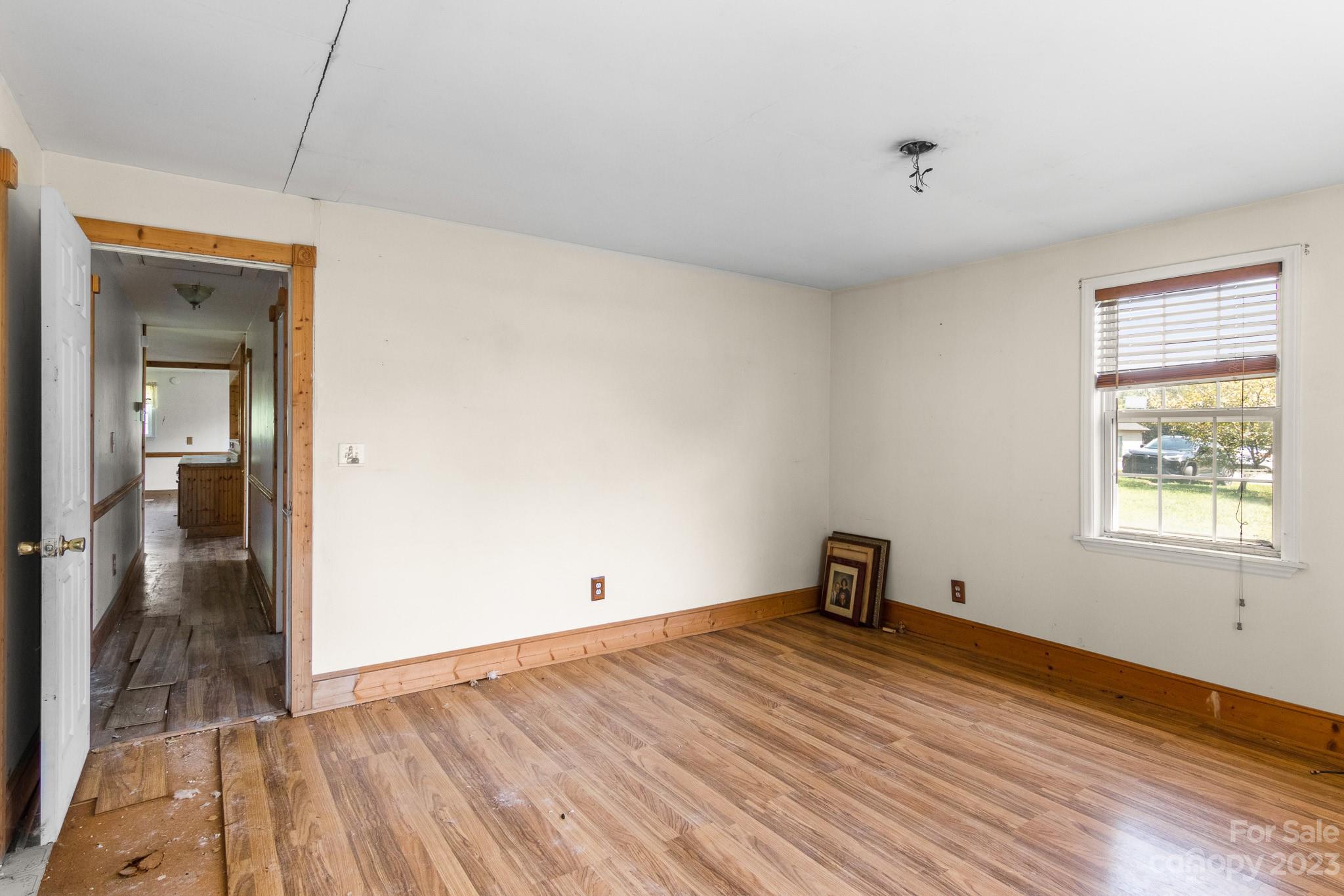 716 Robin Avenue Kannapolis, NC 28081 - Photo 21 of 25 a view of empty room with wooden floor and fan