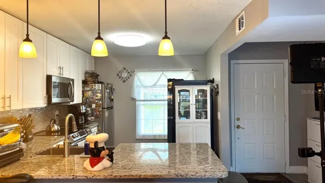 $242,000 | 13840 Timberbrooke Drive, Unit 103, Orlando, FL 32824