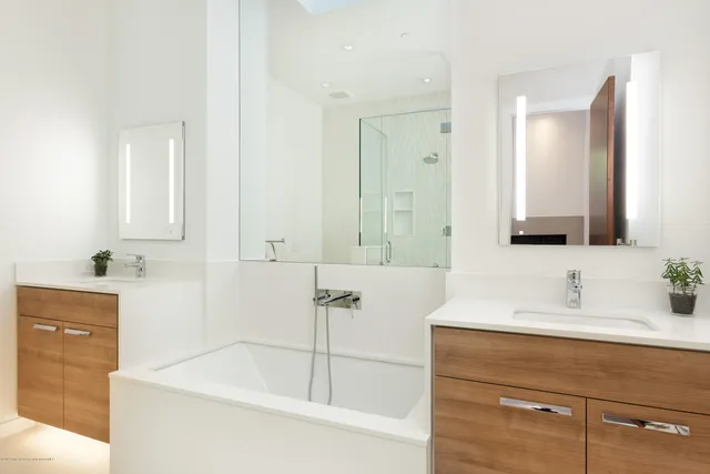 a bathroom with a bathtub and a sink