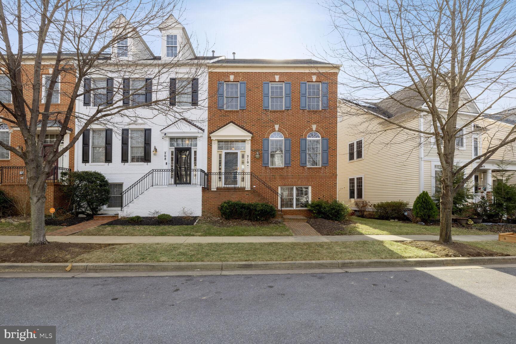 210 Watkins Pond Boulevard Rockville, MD 20850 - Photo 1 of 27 a front view of a house with a yard