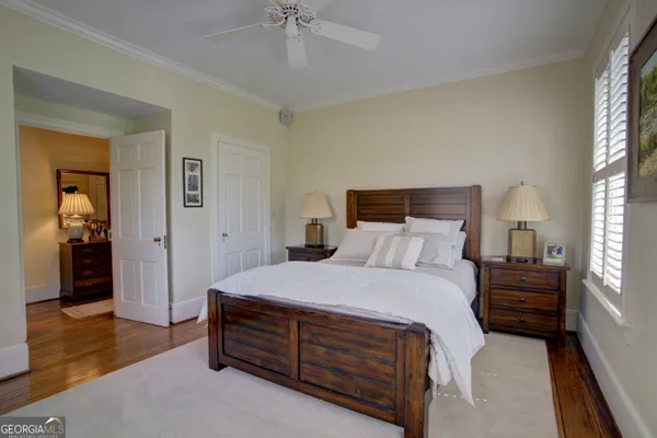 a bathroom with a granite countertop sink a shower and a mirror