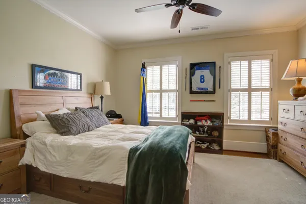 a view of a kitchen with kitchen island a stove a sink and a refrigerator