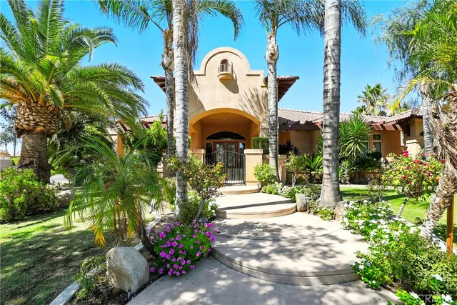 a view of a fountain in front of a house