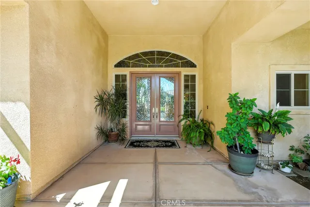 a view of a entryway with furniture and chandelier