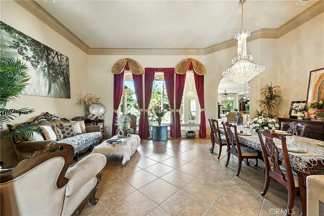 a living room with furniture a fireplace and a window