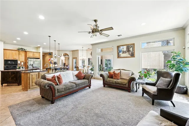 a kitchen with stainless steel appliances granite countertop a stove and cabinets