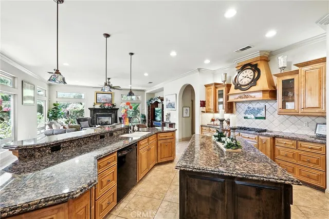 a living room with furniture and a book shelf