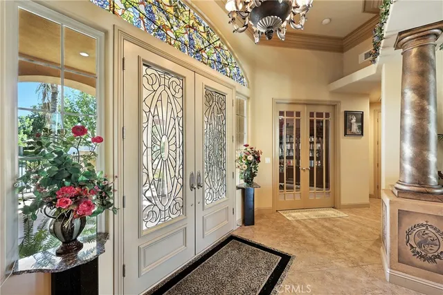 a bedroom with a bed couch and a window
