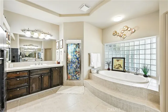 a living room with furniture a window and a flat screen tv