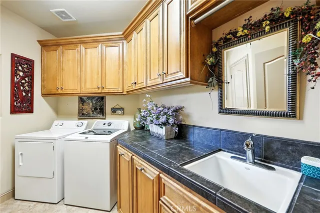 a dining room with furniture and a large window