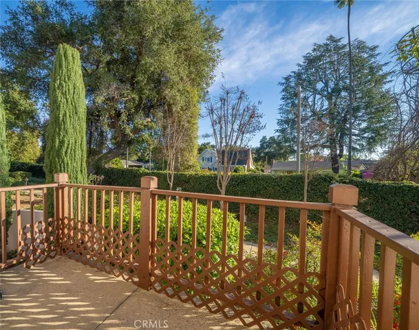 a view of a roof deck with wooden fence