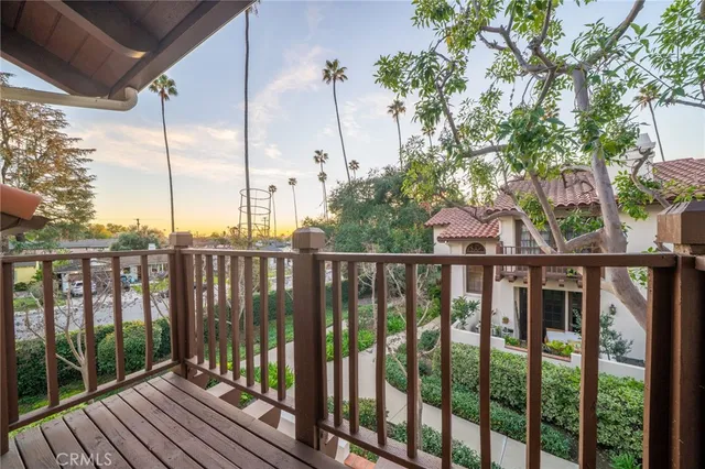 a view of a balcony with wooden floor