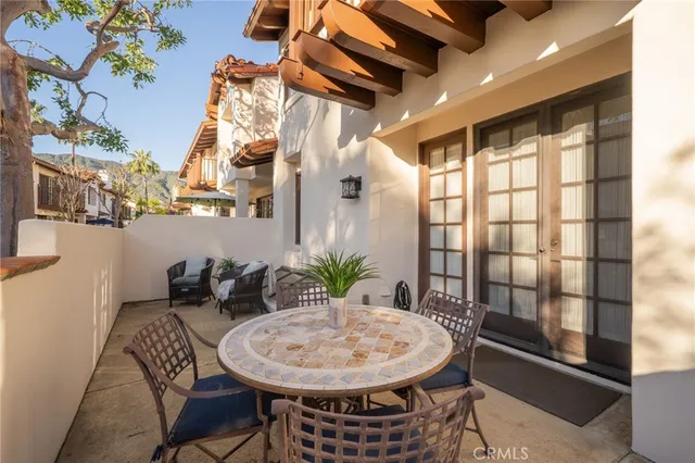 a view of a dining room with furniture and window