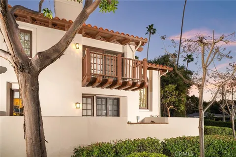 a view of a house with a tree