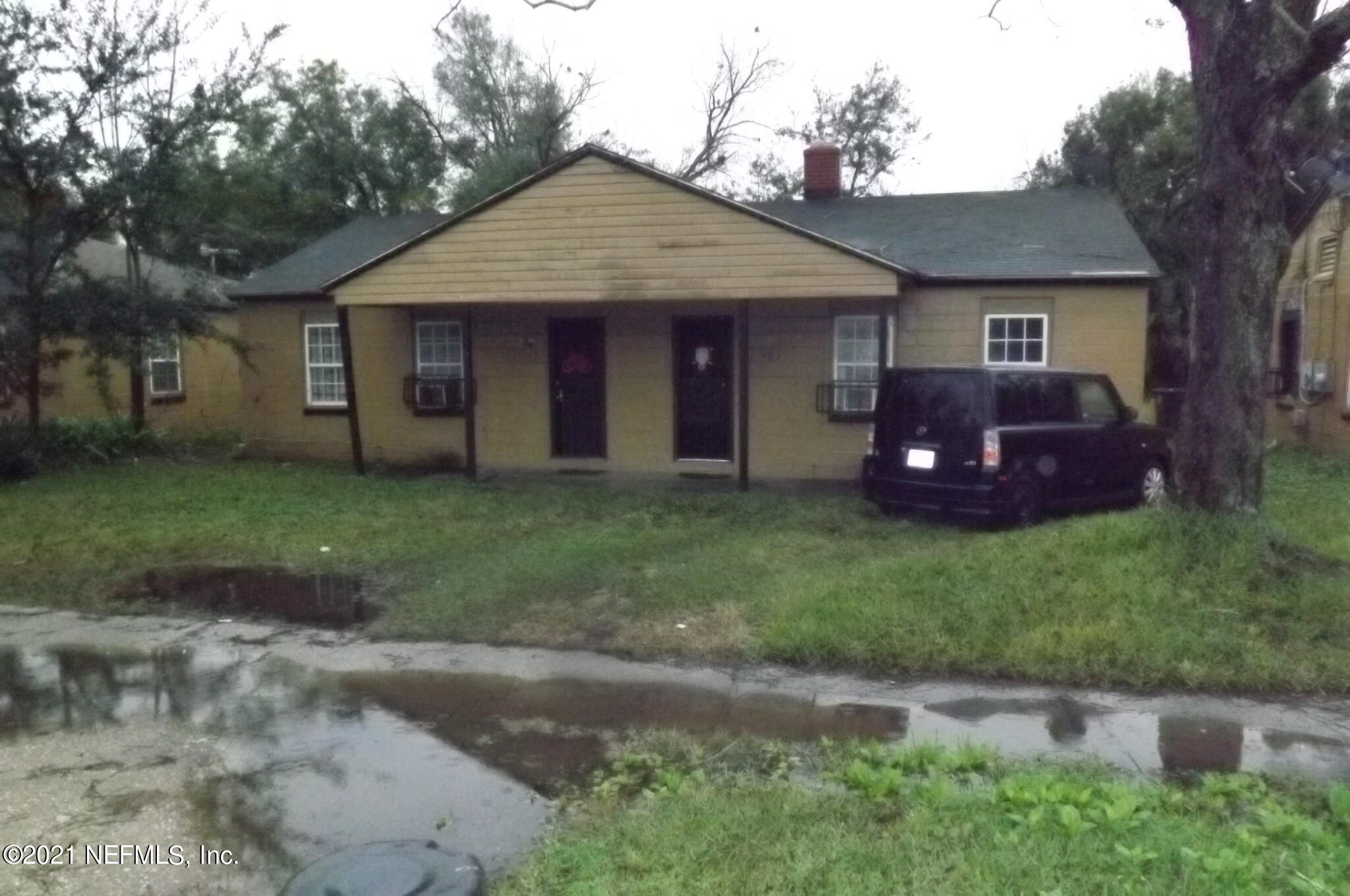 2540 Moncrief Road Jacksonville, FL 32209 - Photo 1 of 1 a front view of a house with a garden