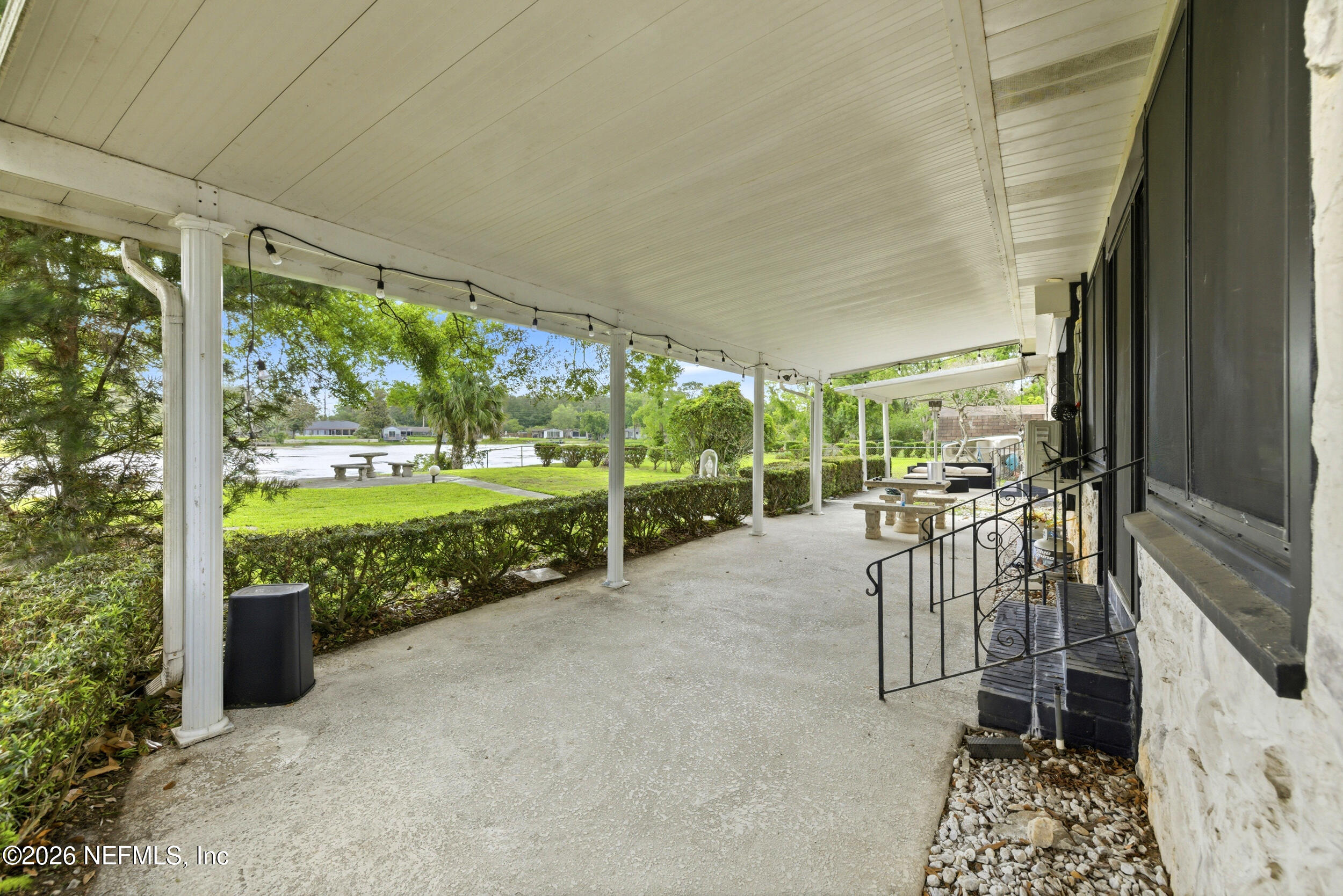 7484 Spinola Road Jacksonville, FL 32217 - Photo 50 of 63 a view of a porch with chairs and backyard