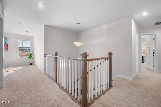 a view of a hallway view with staircase