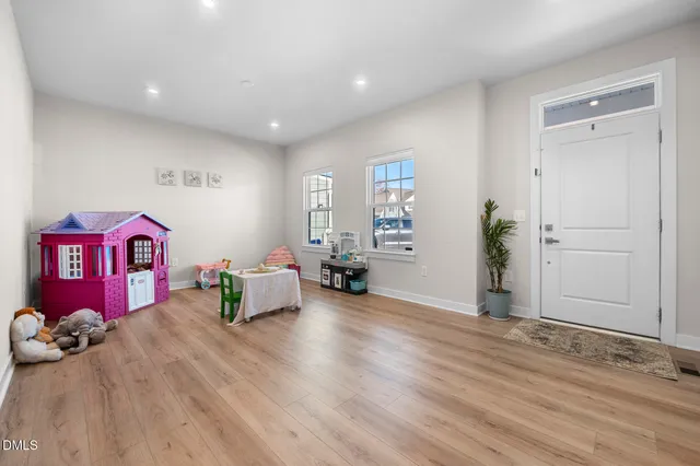 a living room with hard wood flooring and a couch