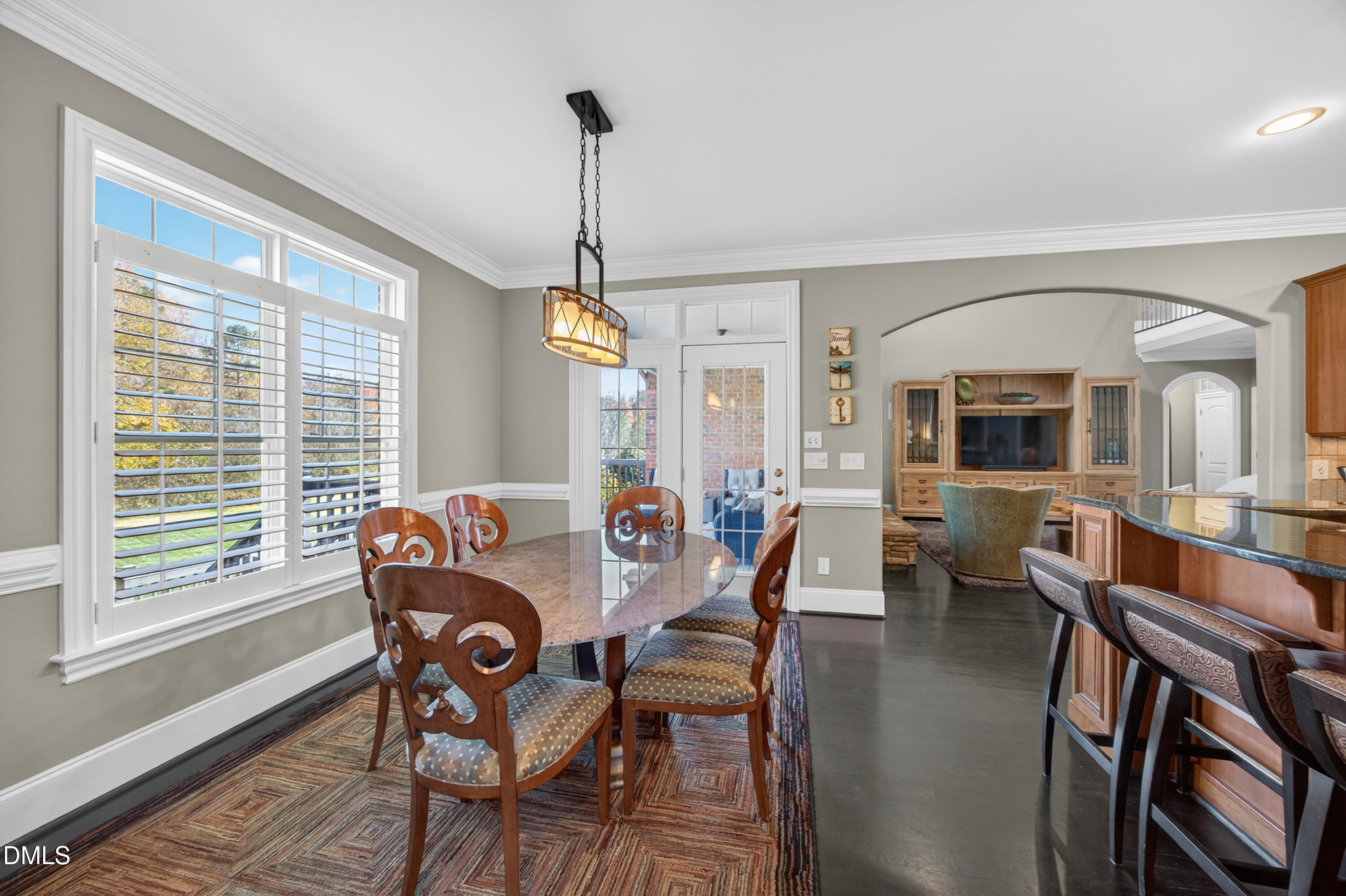 4900 Robdot Drive Oak Ridge, NC 27310 - Photo 11 of 58 a view of a dining room with furniture window and wooden floor