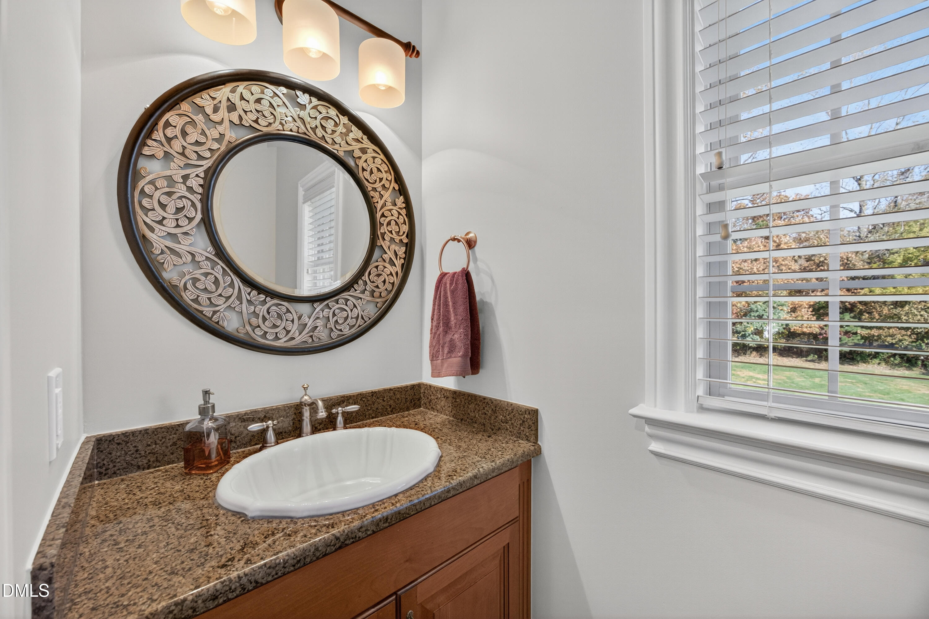 4900 Robdot Drive Oak Ridge, NC 27310 - Photo 20 of 58 a bathroom with a granite countertop sink and a mirror