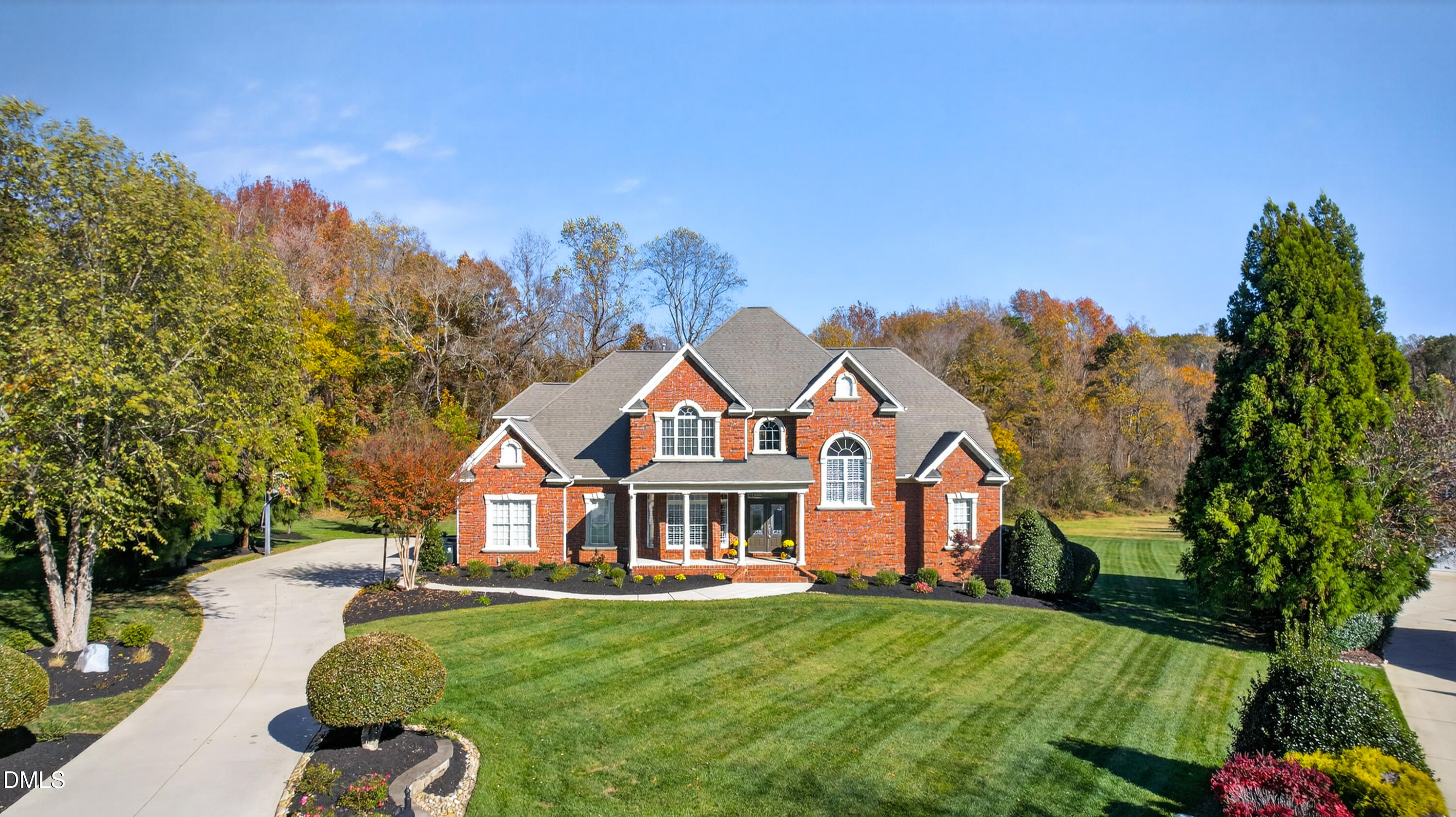 4900 Robdot Drive Oak Ridge, NC 27310 - Photo 2 of 58 a front view of a house with a garden