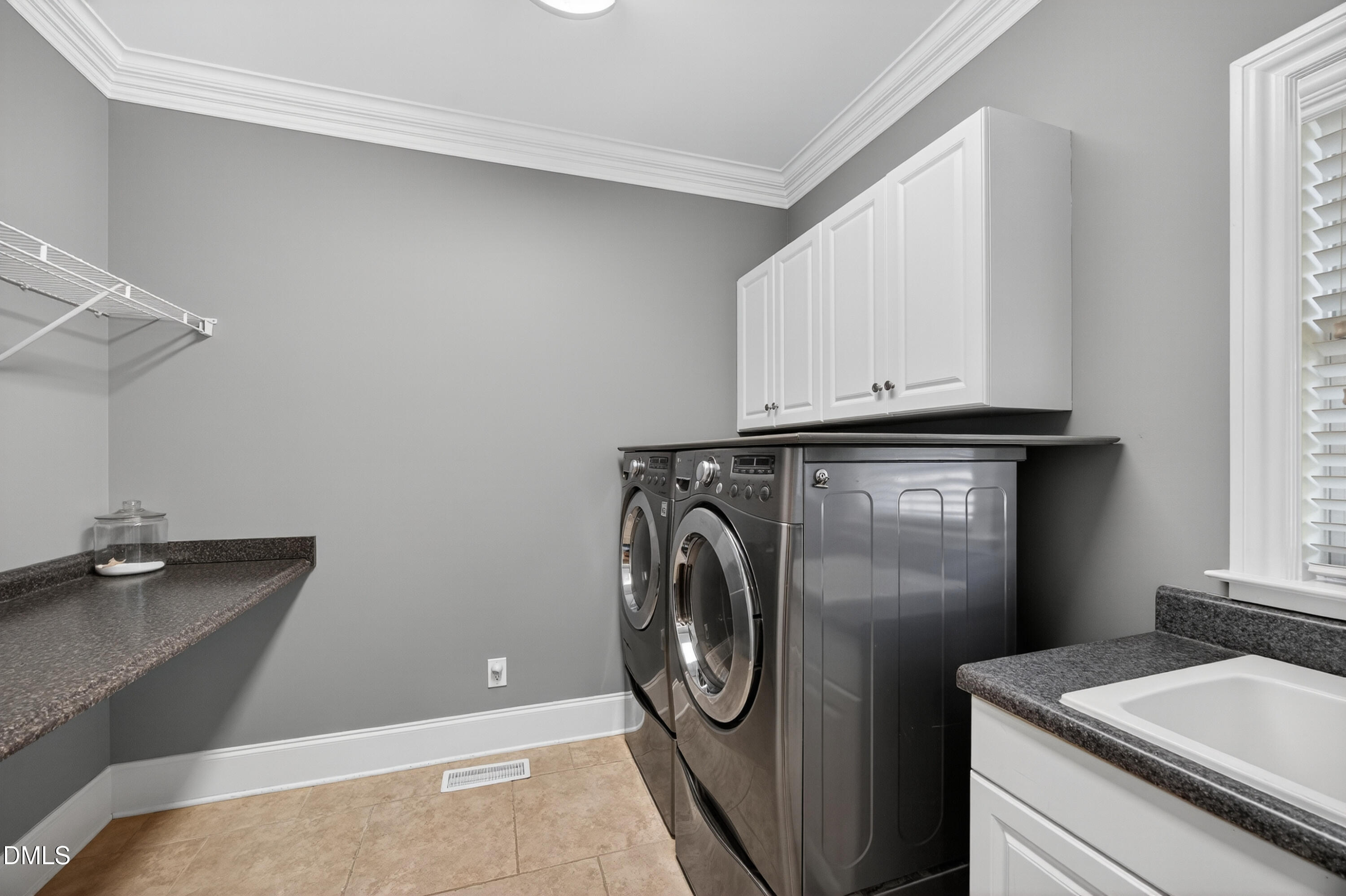 4900 Robdot Drive Oak Ridge, NC 27310 - Photo 21 of 58 a utility room with dryer and washer