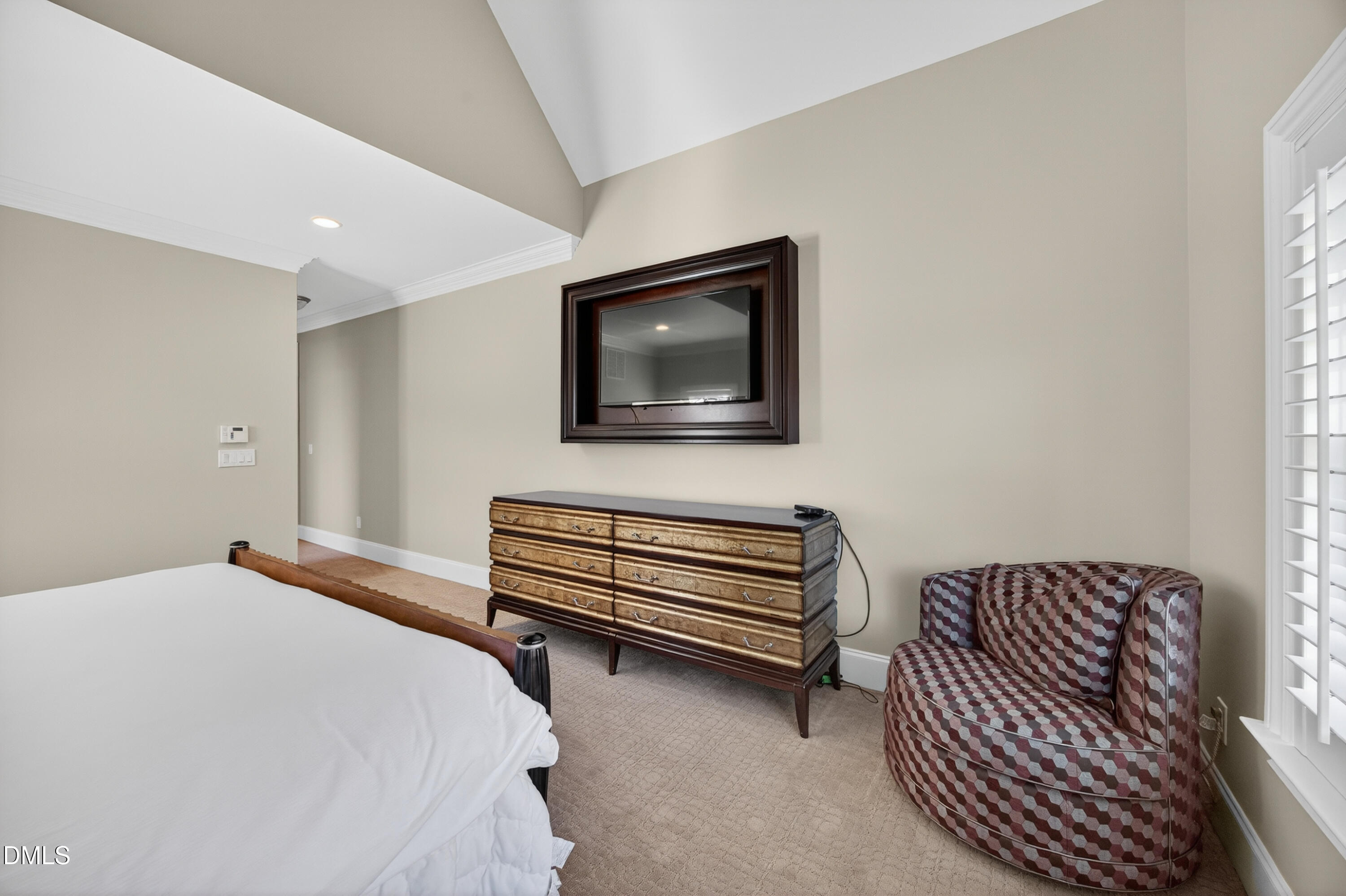 4900 Robdot Drive Oak Ridge, NC 27310 - Photo 23 of 58 a bedroom with a bed and a television