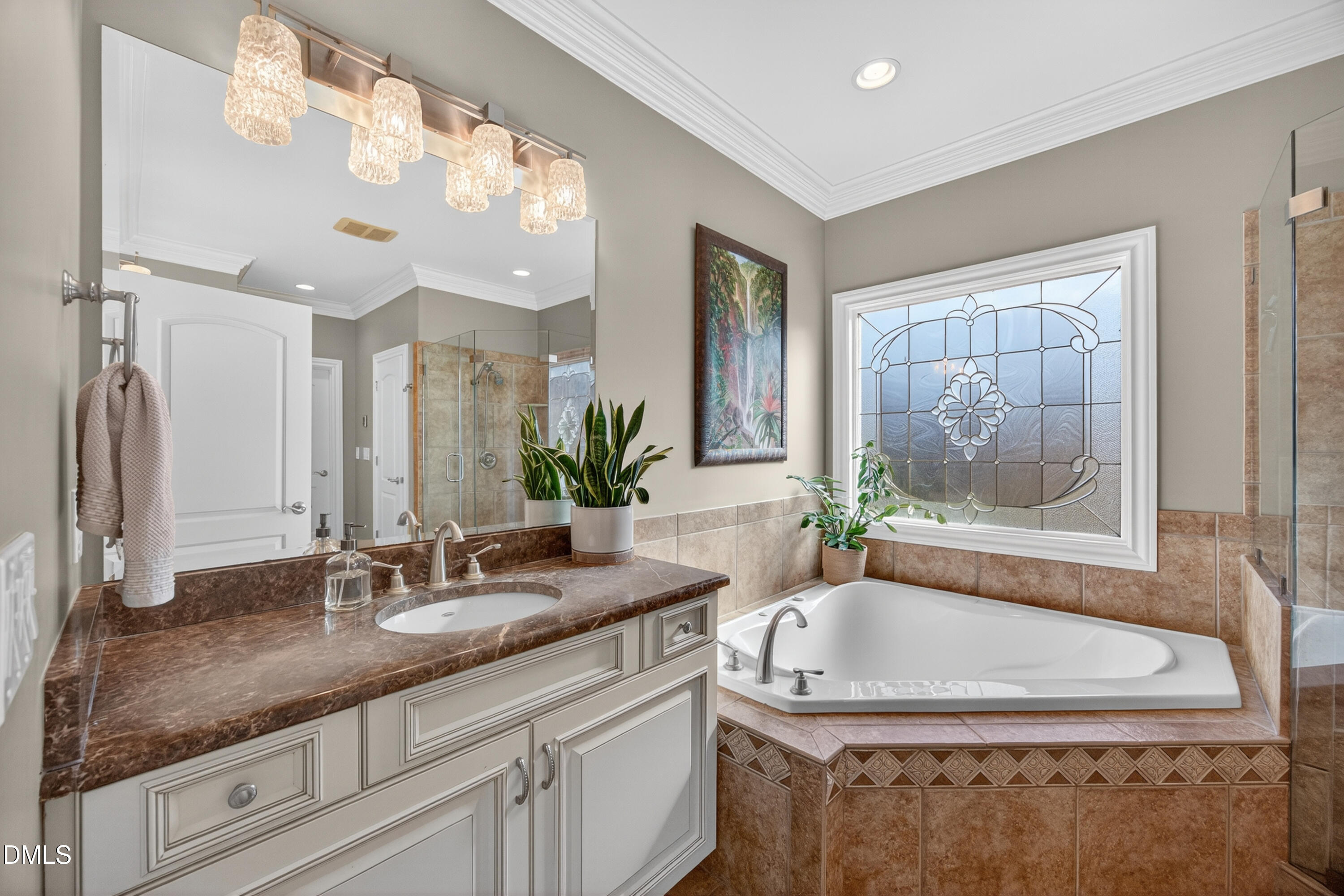 4900 Robdot Drive Oak Ridge, NC 27310 - Photo 24 of 58 a bathroom with a granite countertop tub a sink and mirror