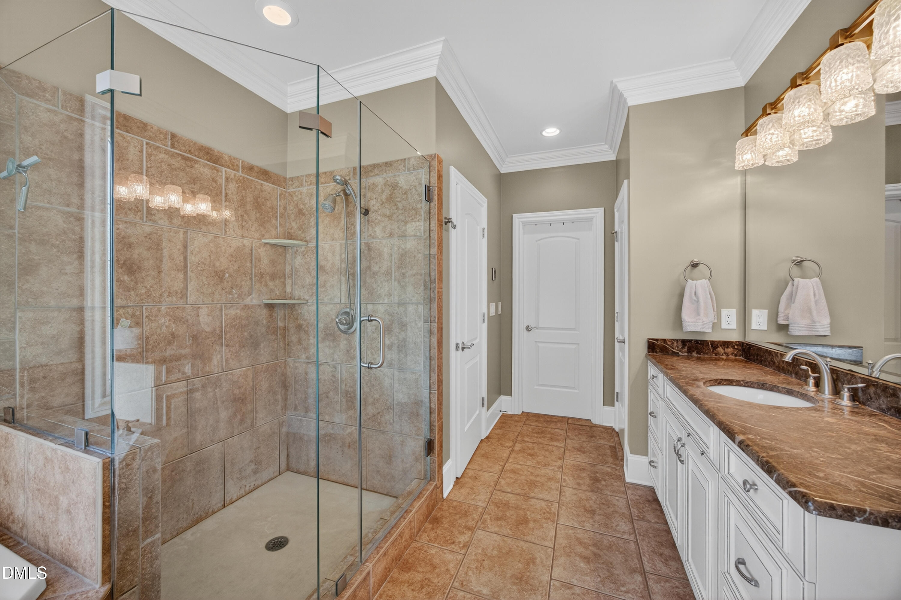 4900 Robdot Drive Oak Ridge, NC 27310 - Photo 25 of 58 a bathroom with a granite countertop sink a mirror a shower and a bathtub