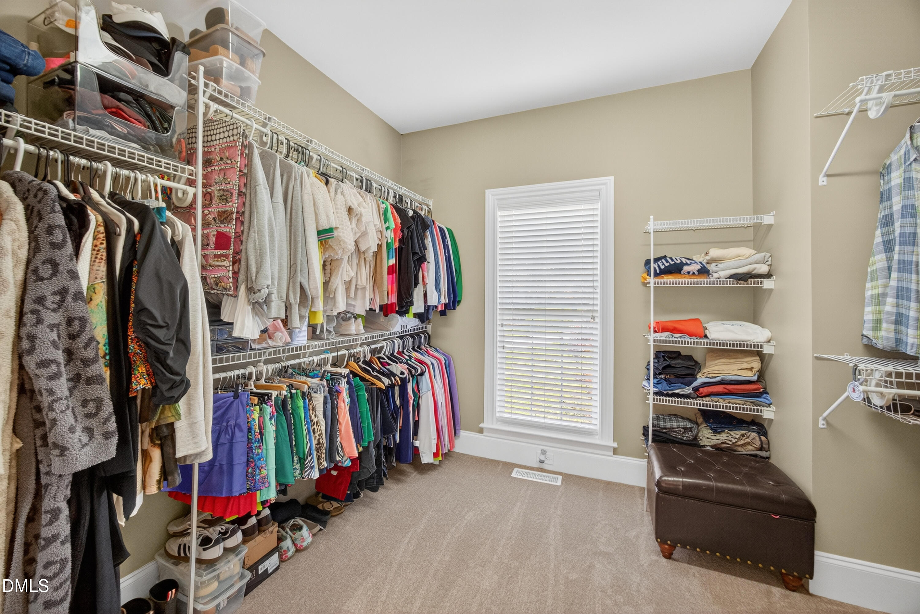 4900 Robdot Drive Oak Ridge, NC 27310 - Photo 26 of 58 a view of walk in closet with clothes