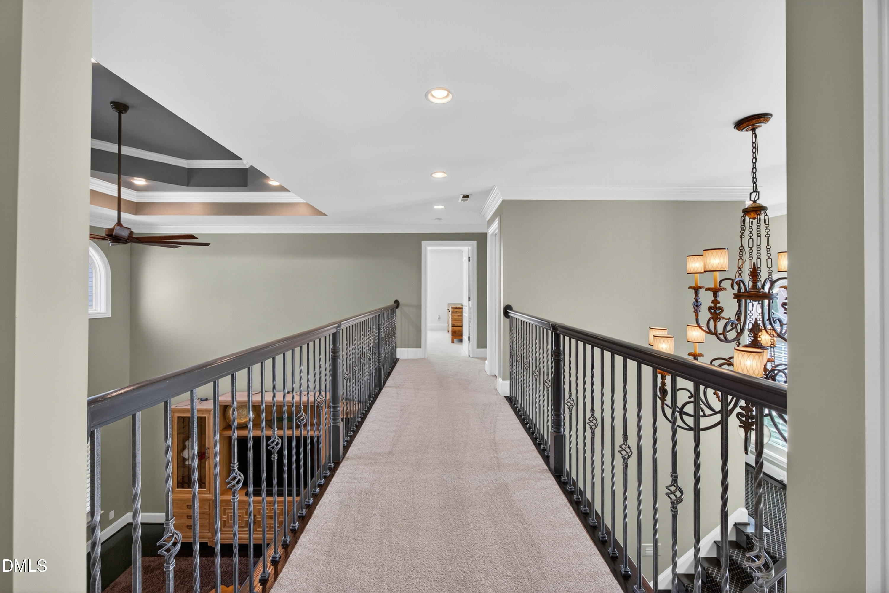 4900 Robdot Drive Oak Ridge, NC 27310 - Photo 27 of 58 a view of a hallway with wooden floor and stairs