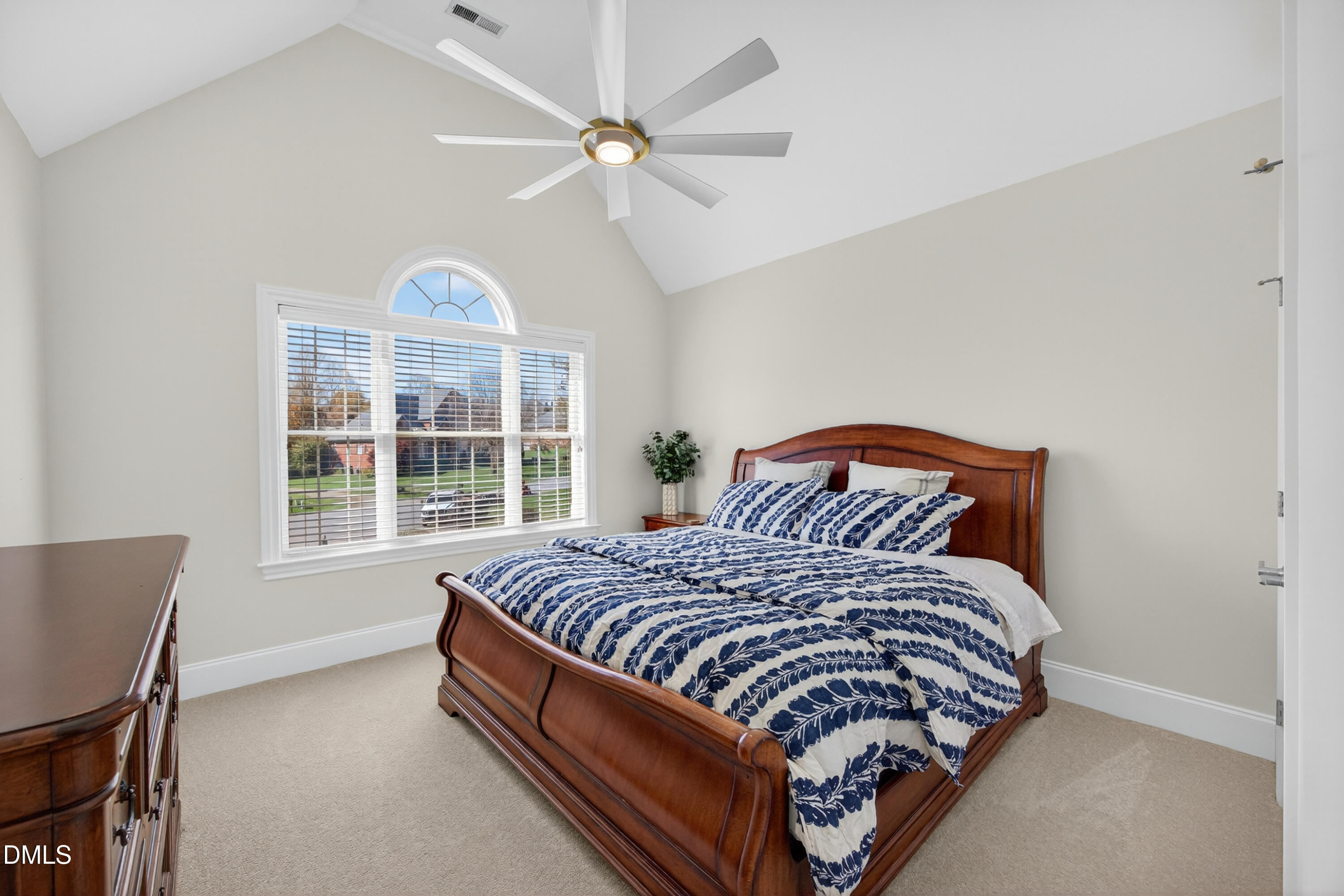 4900 Robdot Drive Oak Ridge, NC 27310 - Photo 30 of 58 a bed sitting in a bedroom next to a window