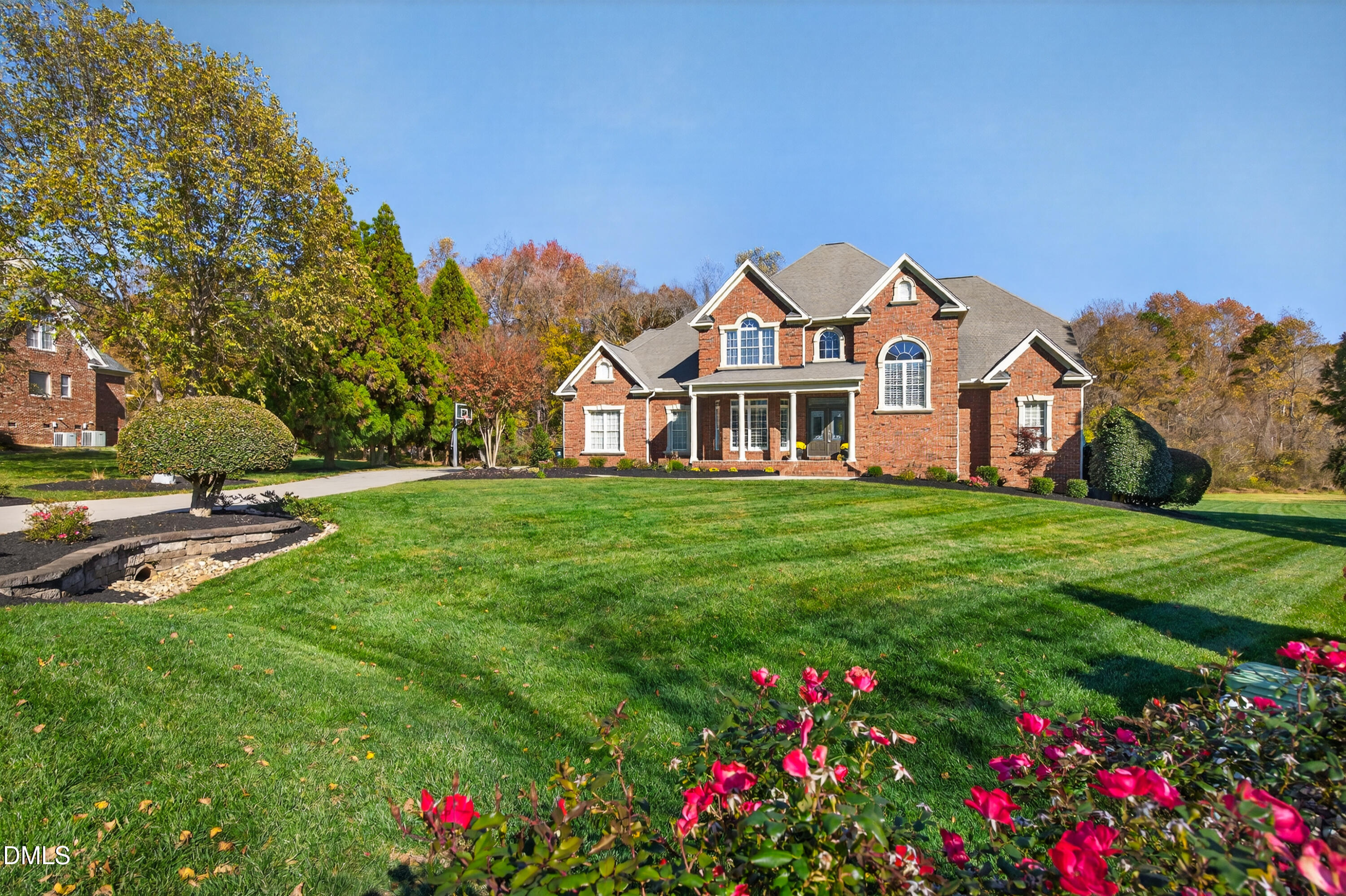 4900 Robdot Drive Oak Ridge, NC 27310 - Photo 3 of 58 a front view of a house with garden