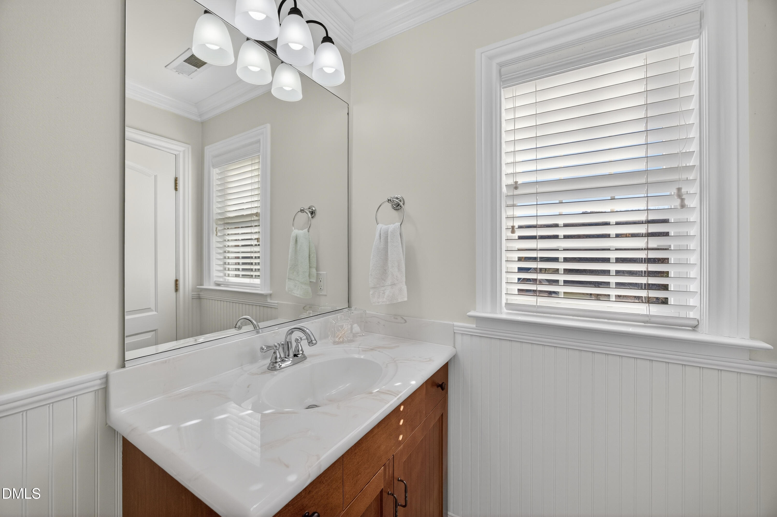 4900 Robdot Drive Oak Ridge, NC 27310 - Photo 34 of 58 a bathroom with a sink a vanity and a mirror
