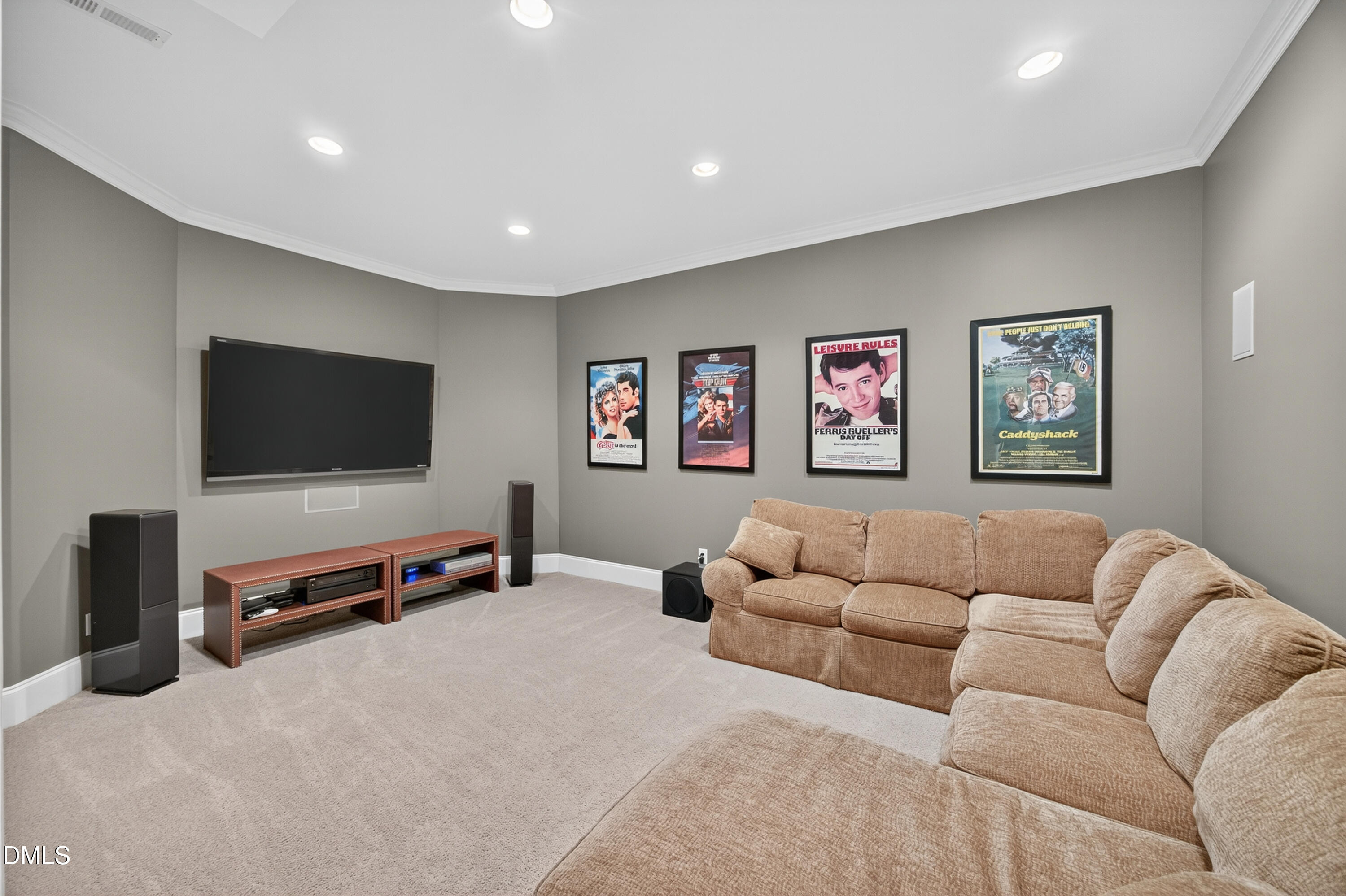 4900 Robdot Drive Oak Ridge, NC 27310 - Photo 38 of 58 a living room with furniture and a flat screen tv