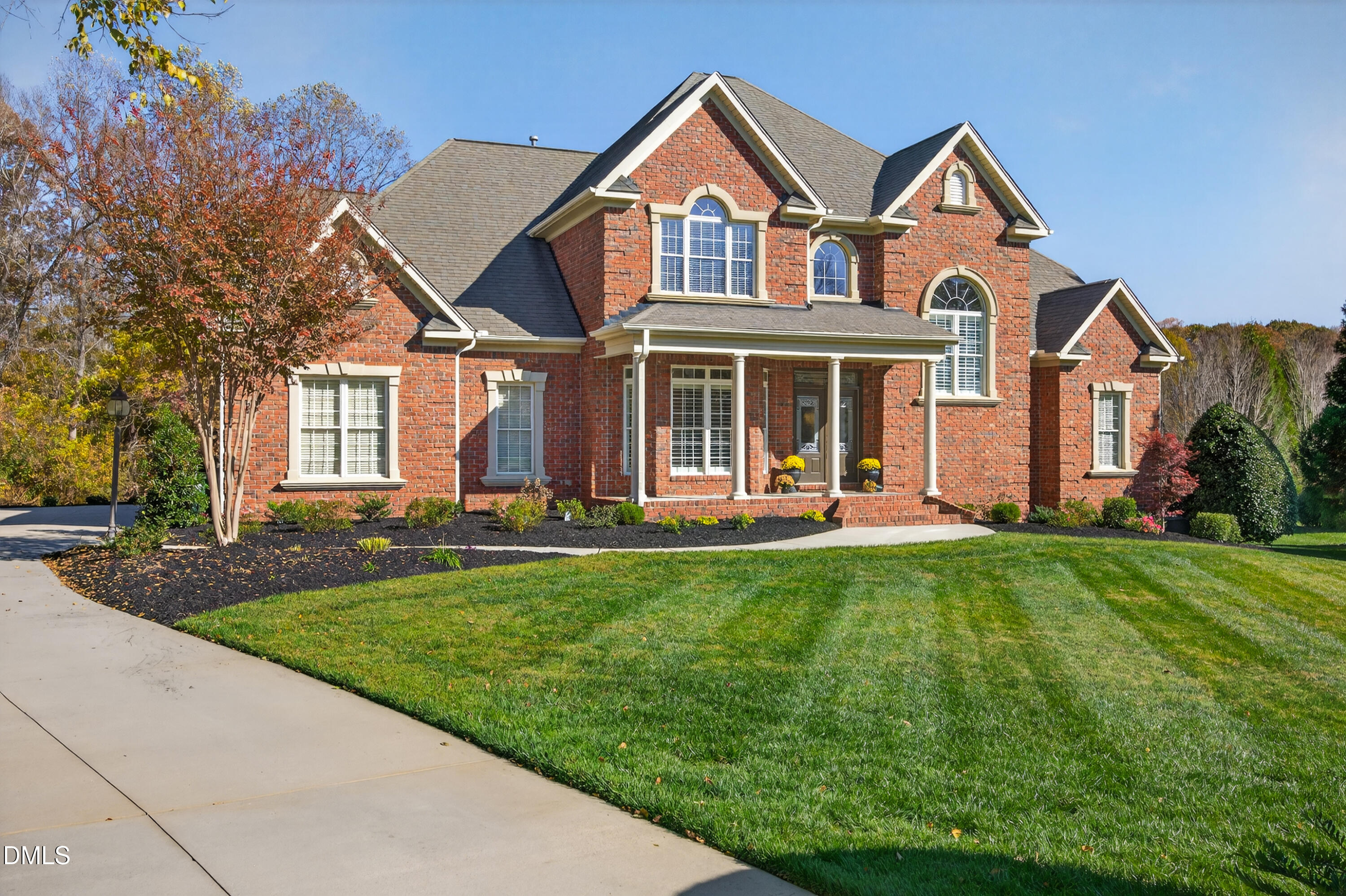4900 Robdot Drive Oak Ridge, NC 27310 - Photo 4 of 58 a front view of a house with yard and green space