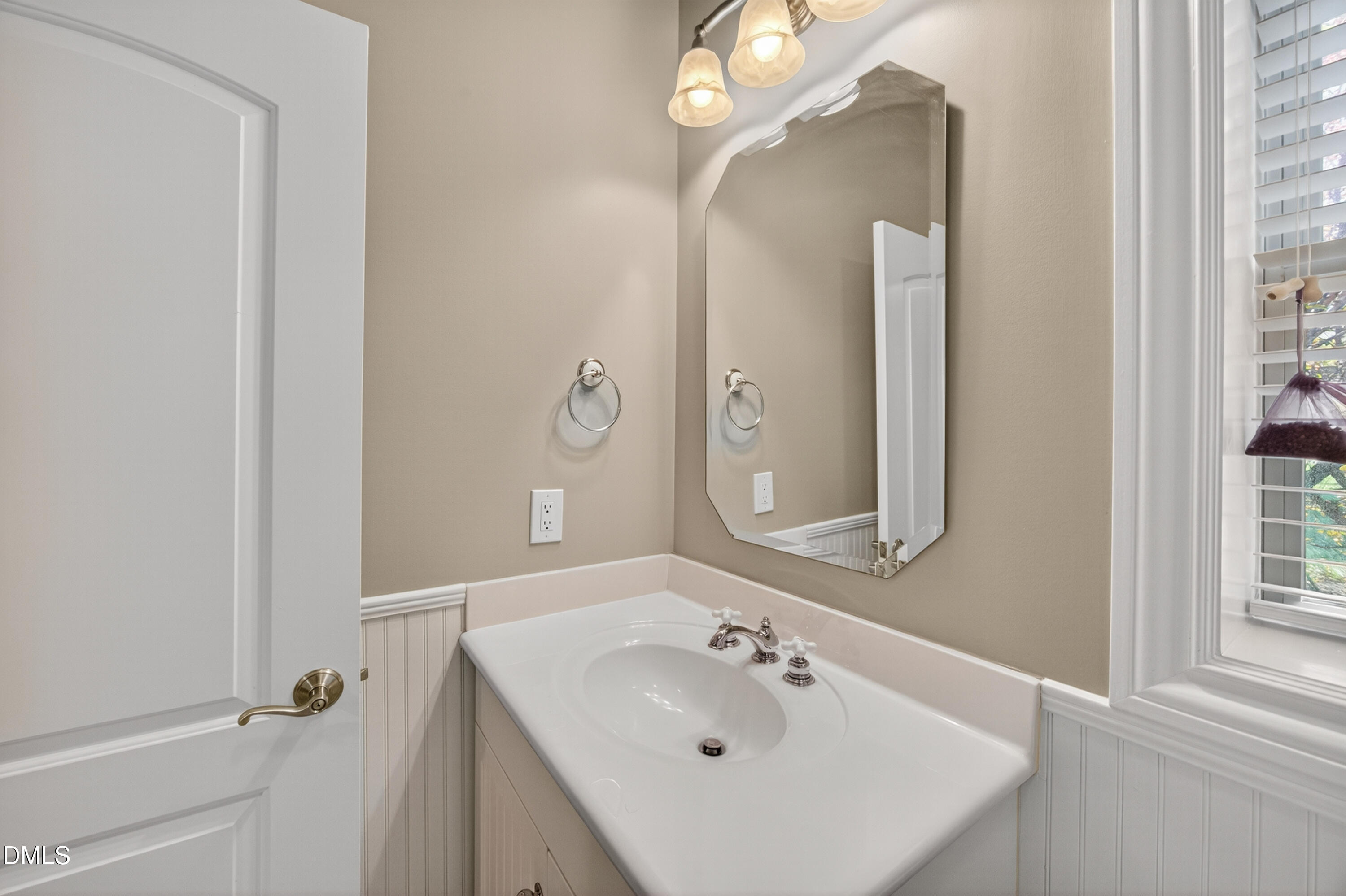 4900 Robdot Drive Oak Ridge, NC 27310 - Photo 43 of 58 a bathroom with a sink a mirror and a shower