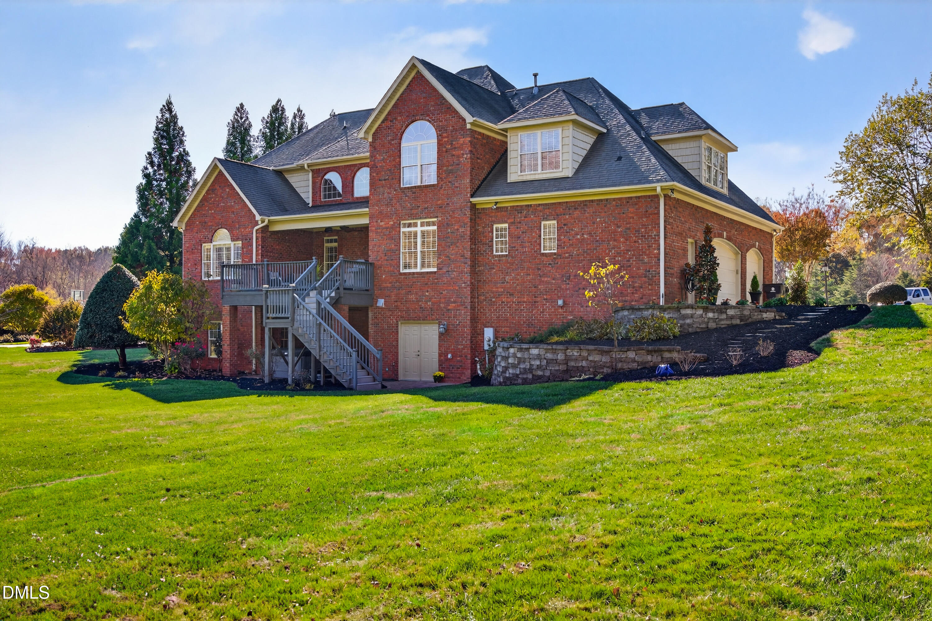 4900 Robdot Drive Oak Ridge, NC 27310 - Photo 52 of 58 a front view of house with yard and green space