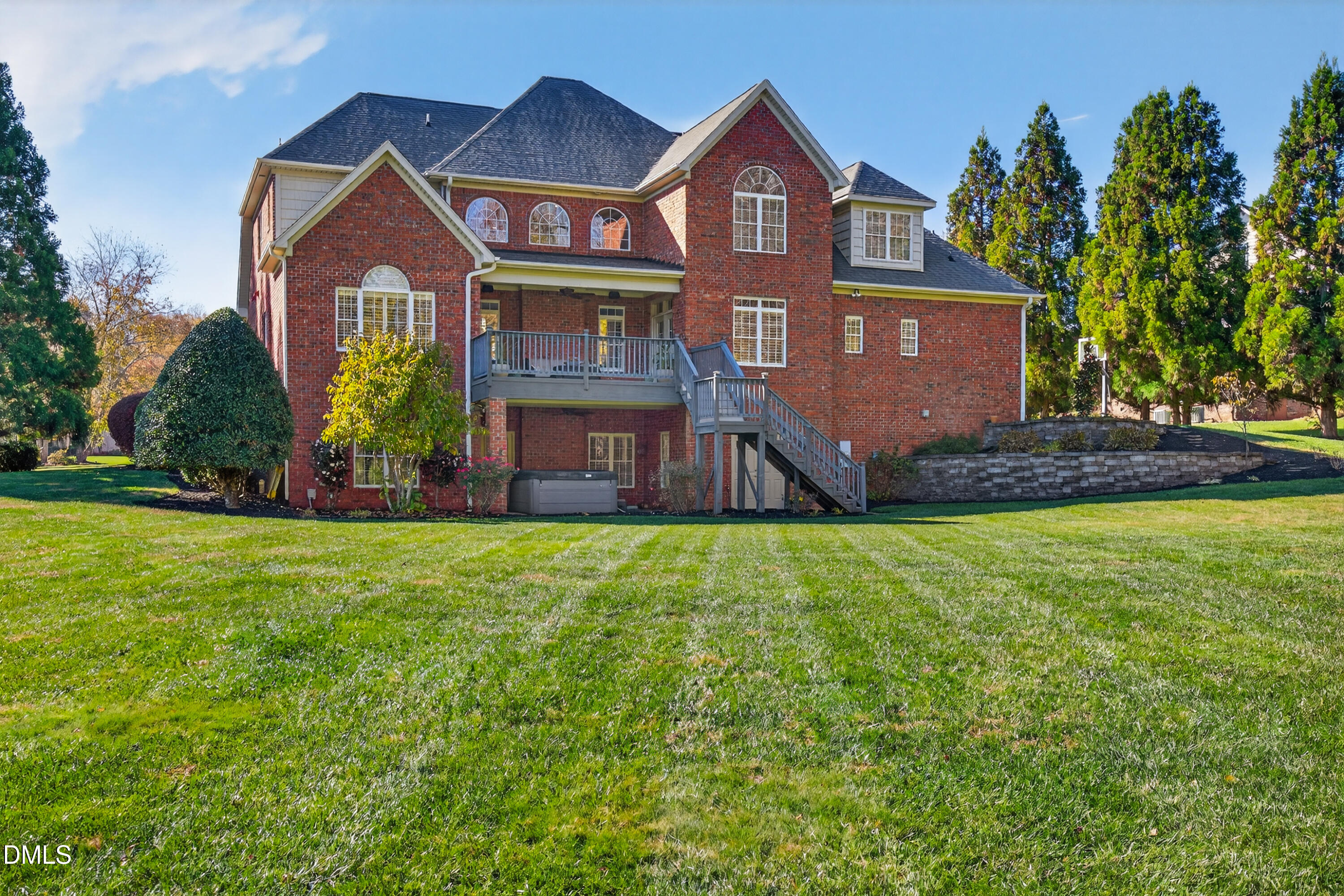4900 Robdot Drive Oak Ridge, NC 27310 - Photo 54 of 58 a front view of a house with a yard and garage