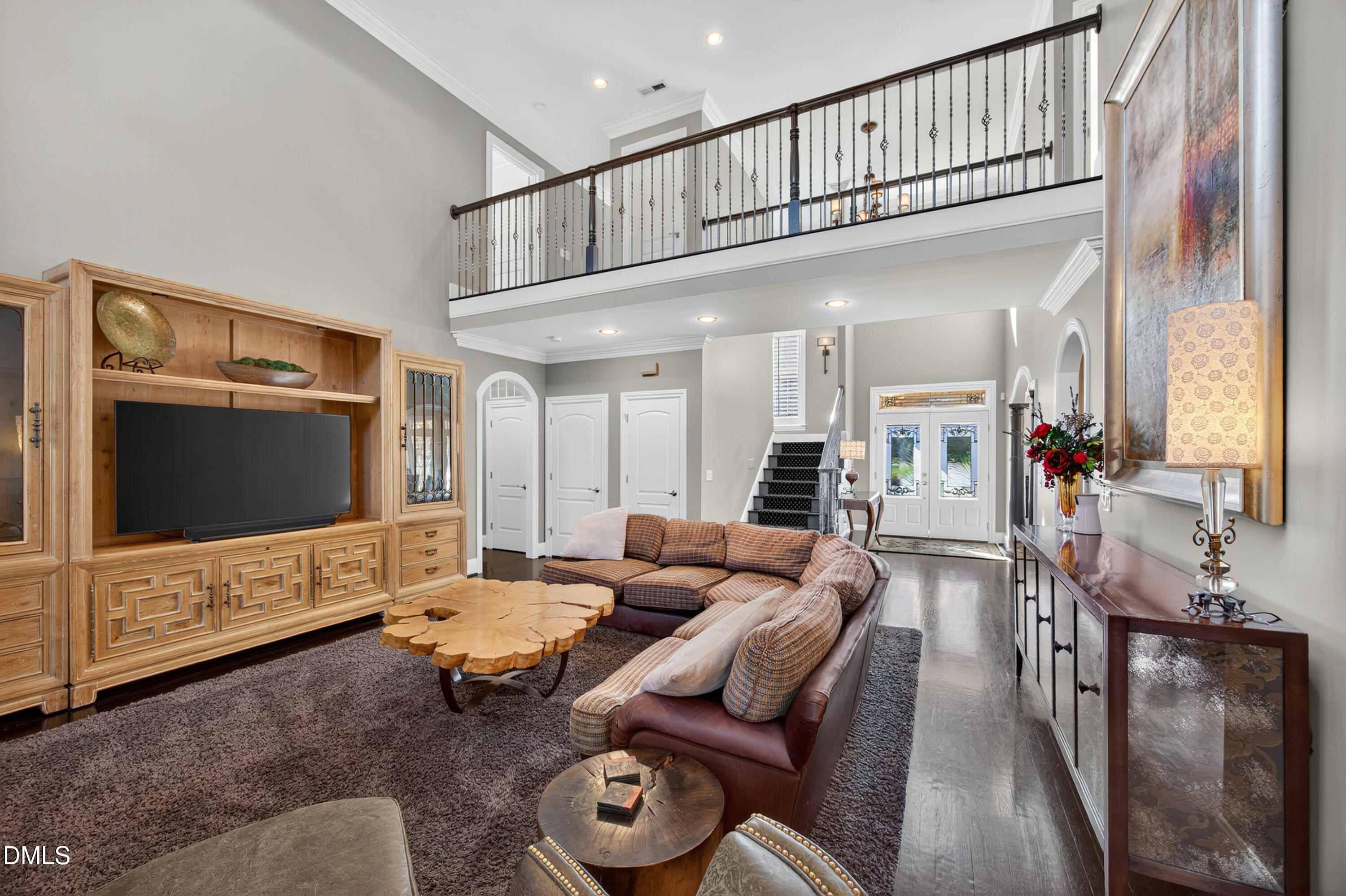 4900 Robdot Drive Oak Ridge, NC 27310 - Photo 7 of 58 a living room with furniture and a flat screen tv