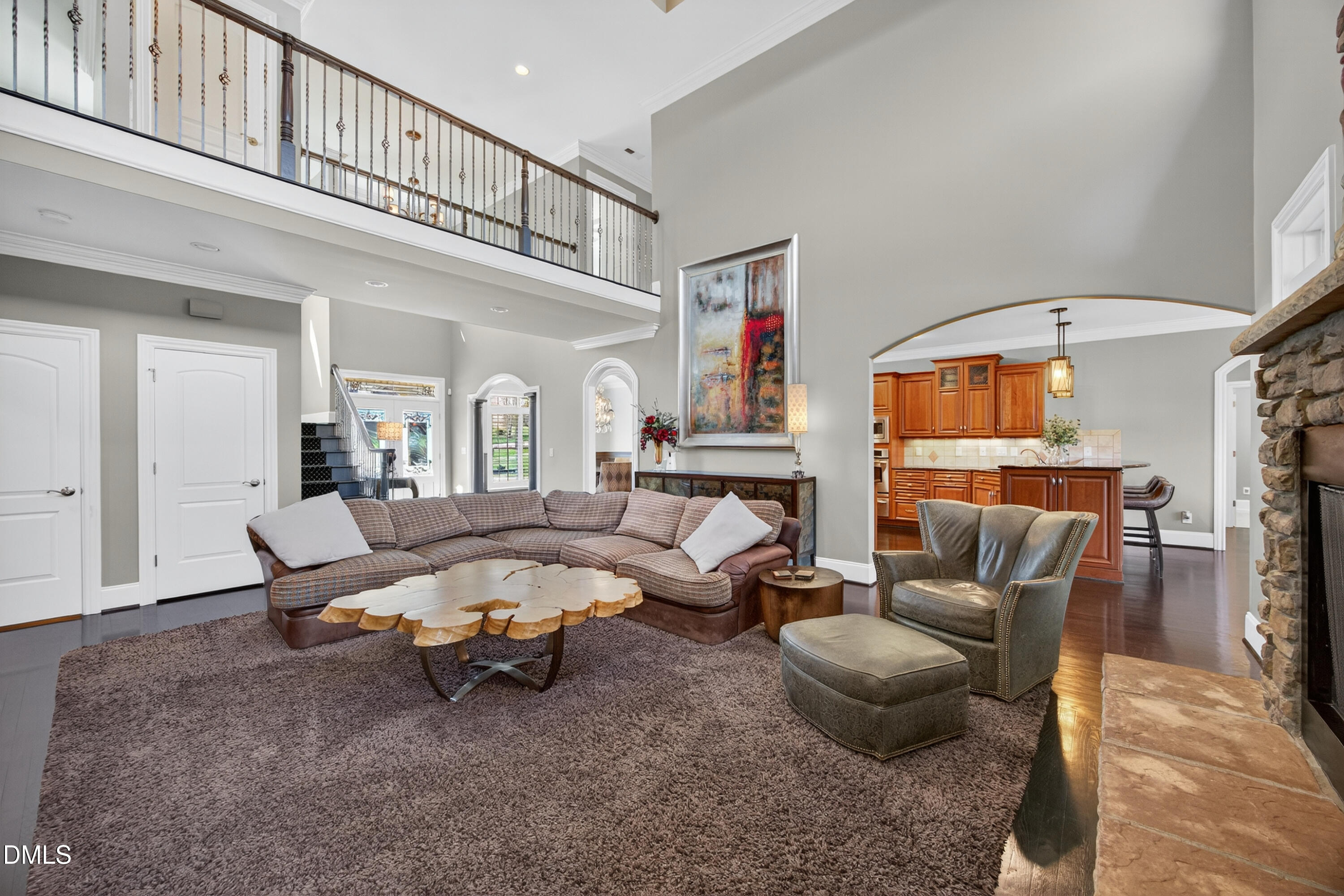 4900 Robdot Drive Oak Ridge, NC 27310 - Photo 10 of 58 a living room with furniture and a chandelier