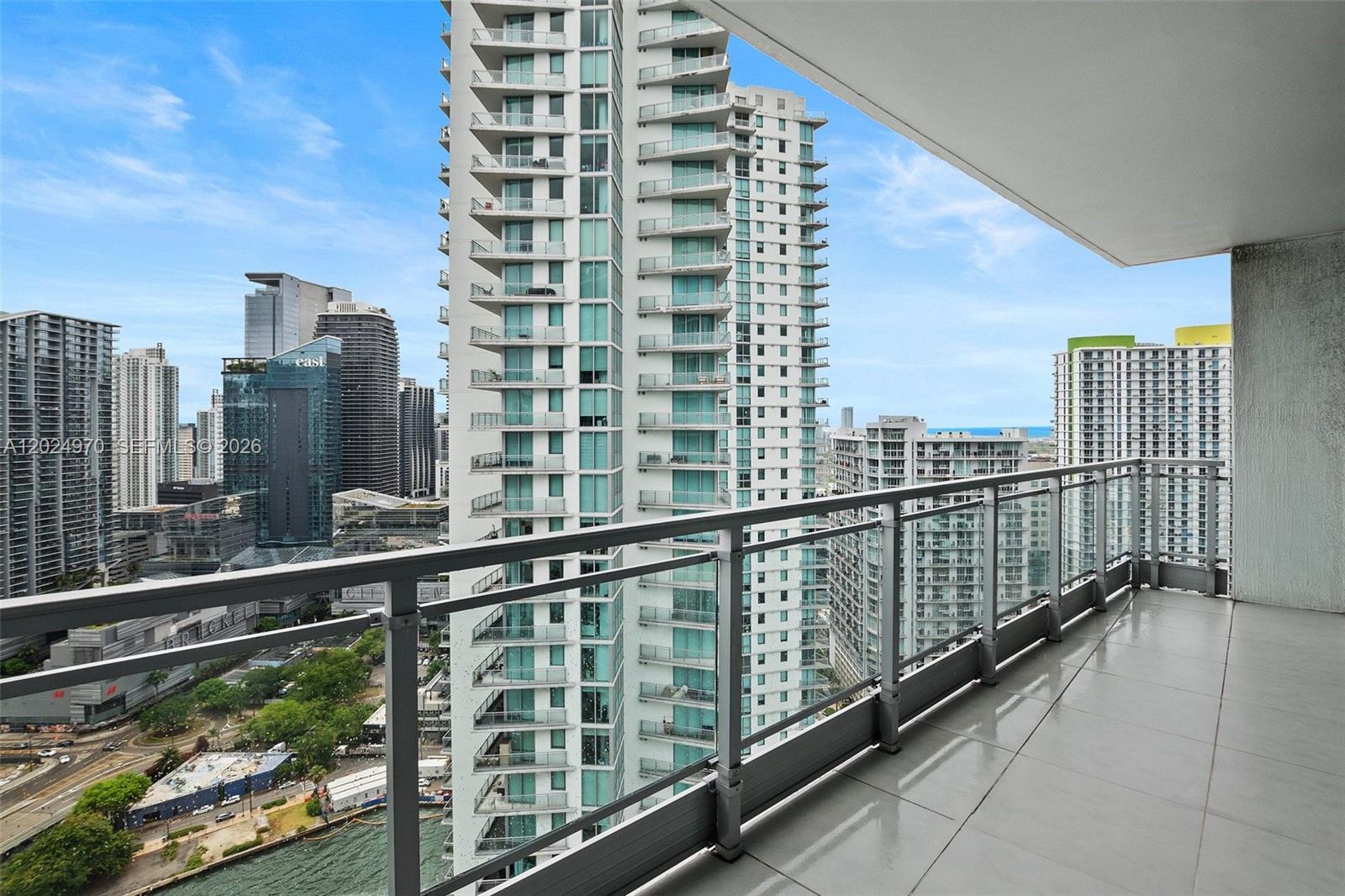 90 Southwest 3rd Street, Unit 3810 Miami, FL 33130 - Photo 12 of 45 a view of a balcony with a floor to ceiling window next to a tall building