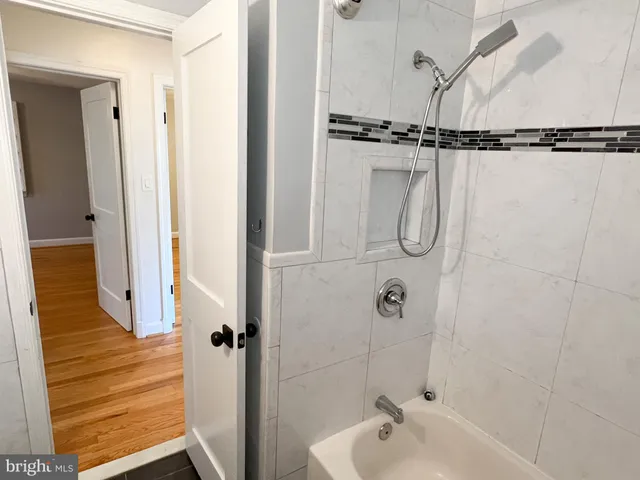 a bathroom with a glass shower door