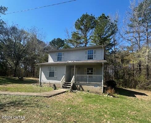 662 Blue Lane Huntingdon, TN 38344 - Photo 1 of 16 a view of a house with backyard and trees