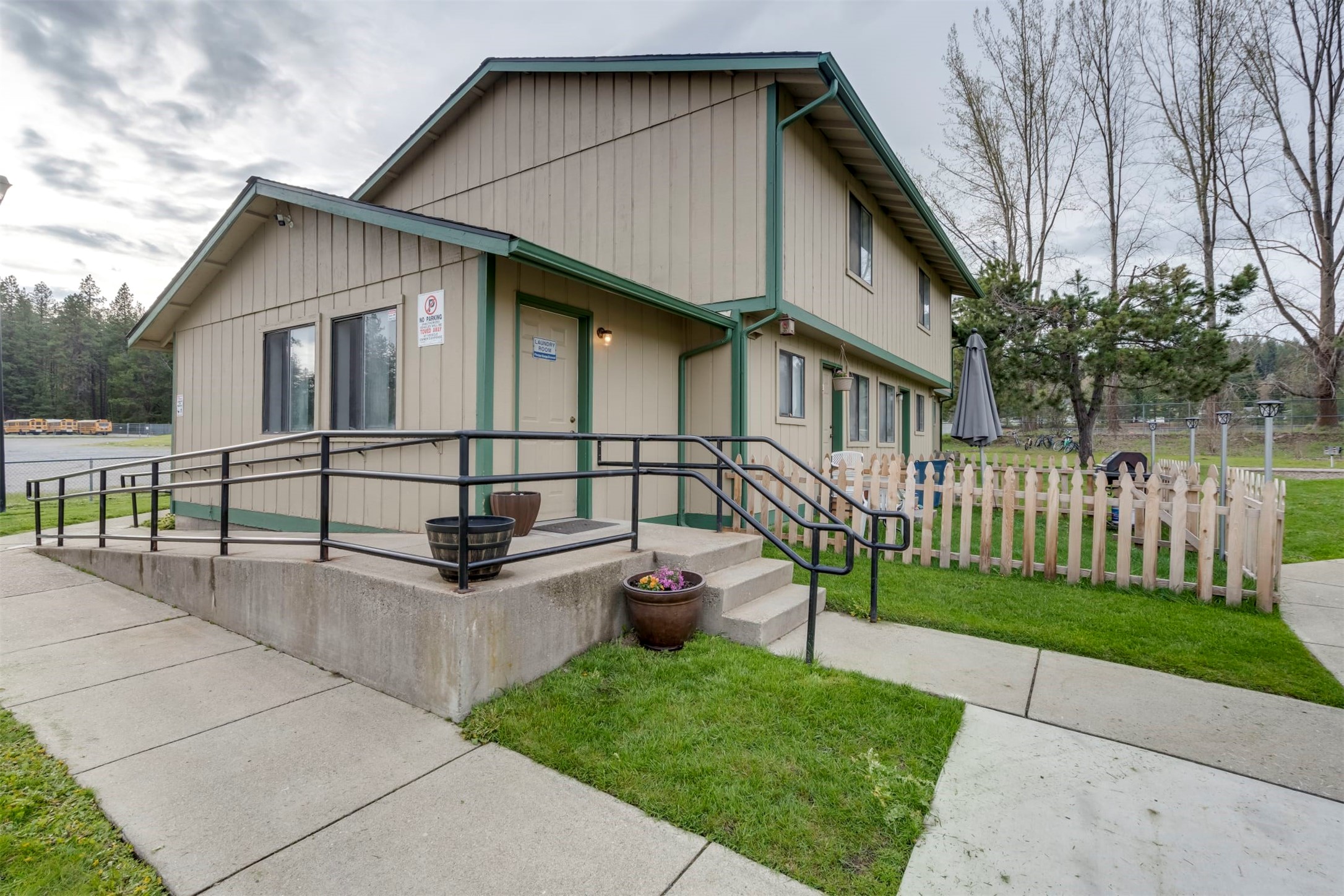 1600 West 7th Street Newport, WA 99156 - Photo 3 of 14 a white house that has tree in front of it