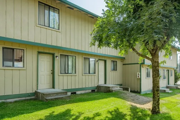 front view of a house with a yard