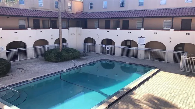 a kitchen with stainless steel appliances granite countertop a sink and a stove top oven